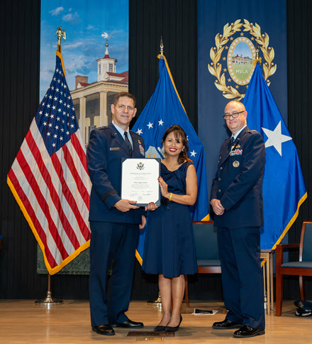 This is at my husband&##x27;s retirement ceremony in November 2024 when I received the Certificate of Appreciation as a Military Spouse taken by my assistant and associate photographer, Jamey Simpson &##x28;USAF 